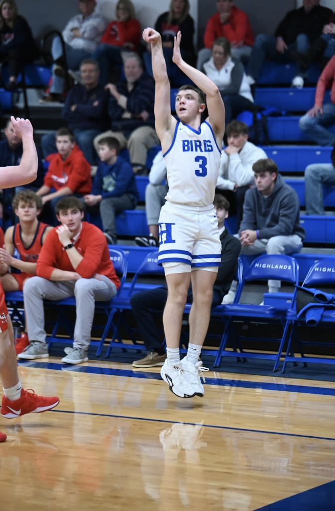 Vinny Listerman(11) shoots a three-point shot from the corner. 